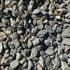 A pile of gravel is sitting on the ground.