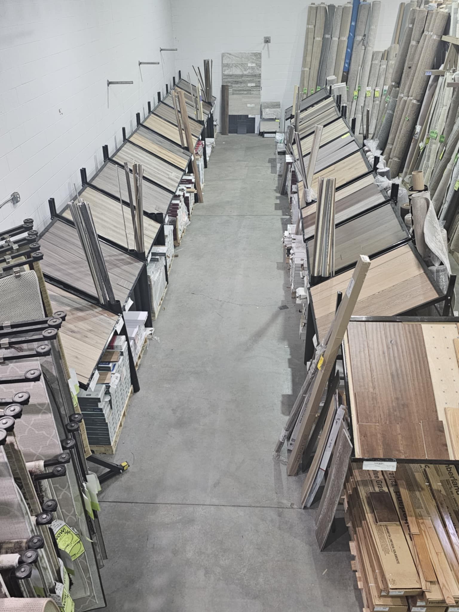An aerial view of a warehouse filled with lots of wooden shelves.