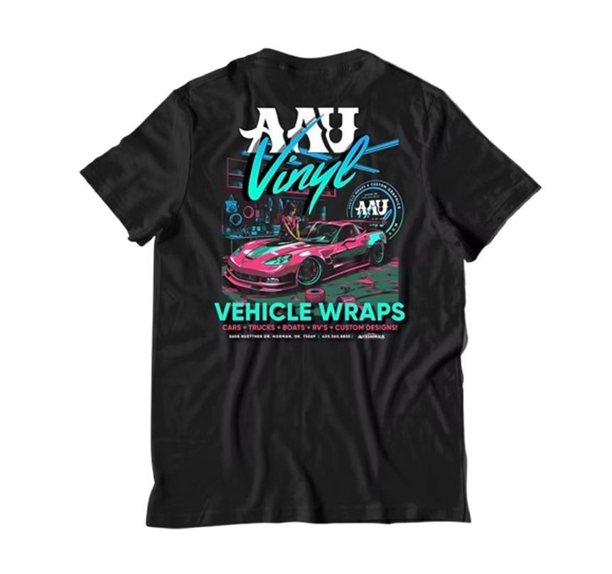 Black T-shirt with AM Vinyl vehicle wraps graphic, featuring a pink sports car and teal lettering.
