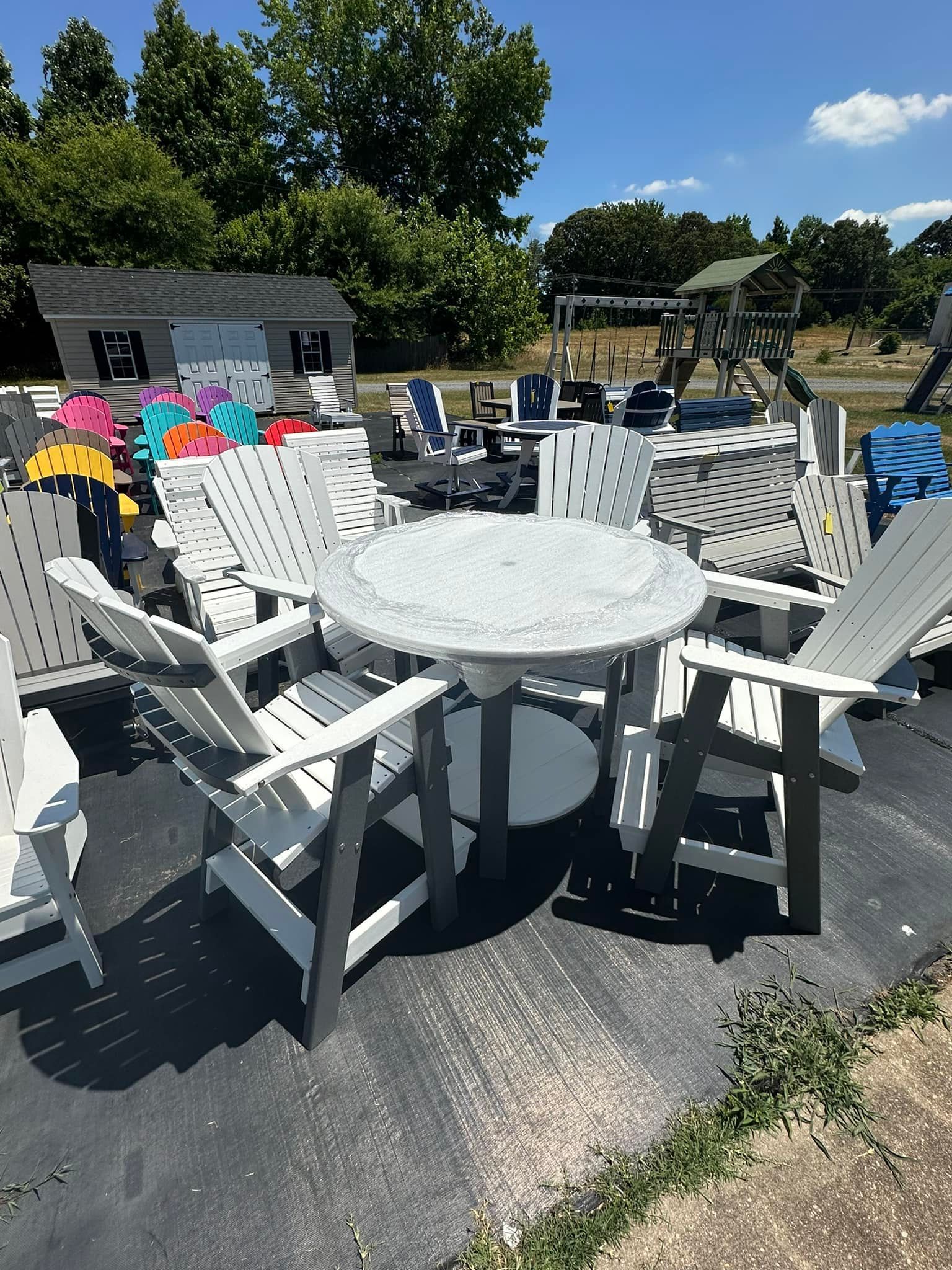 A table and chairs are sitting in a parking lot.