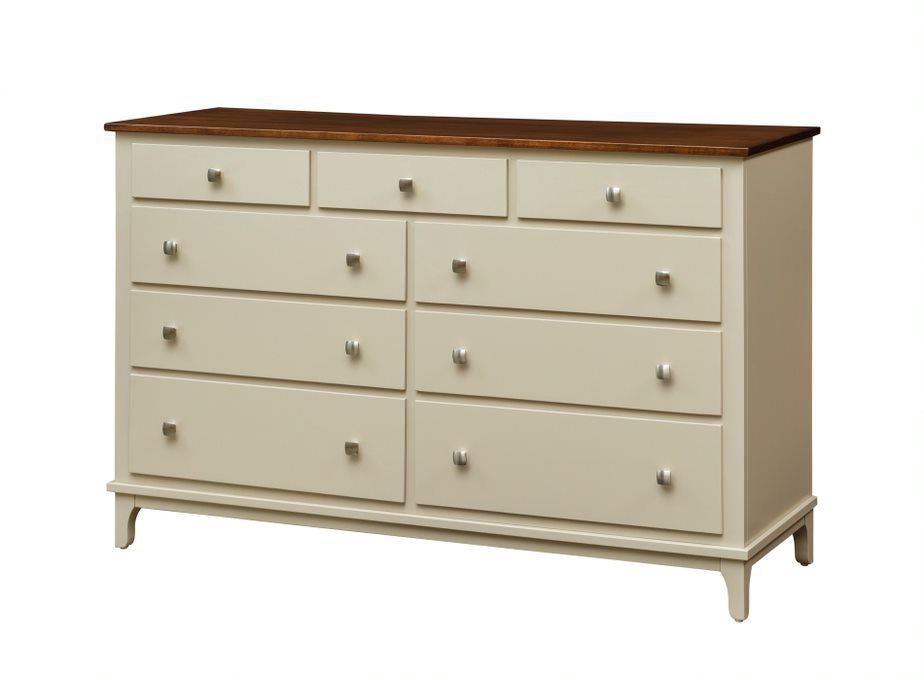 A white dresser with lots of drawers and a wooden top