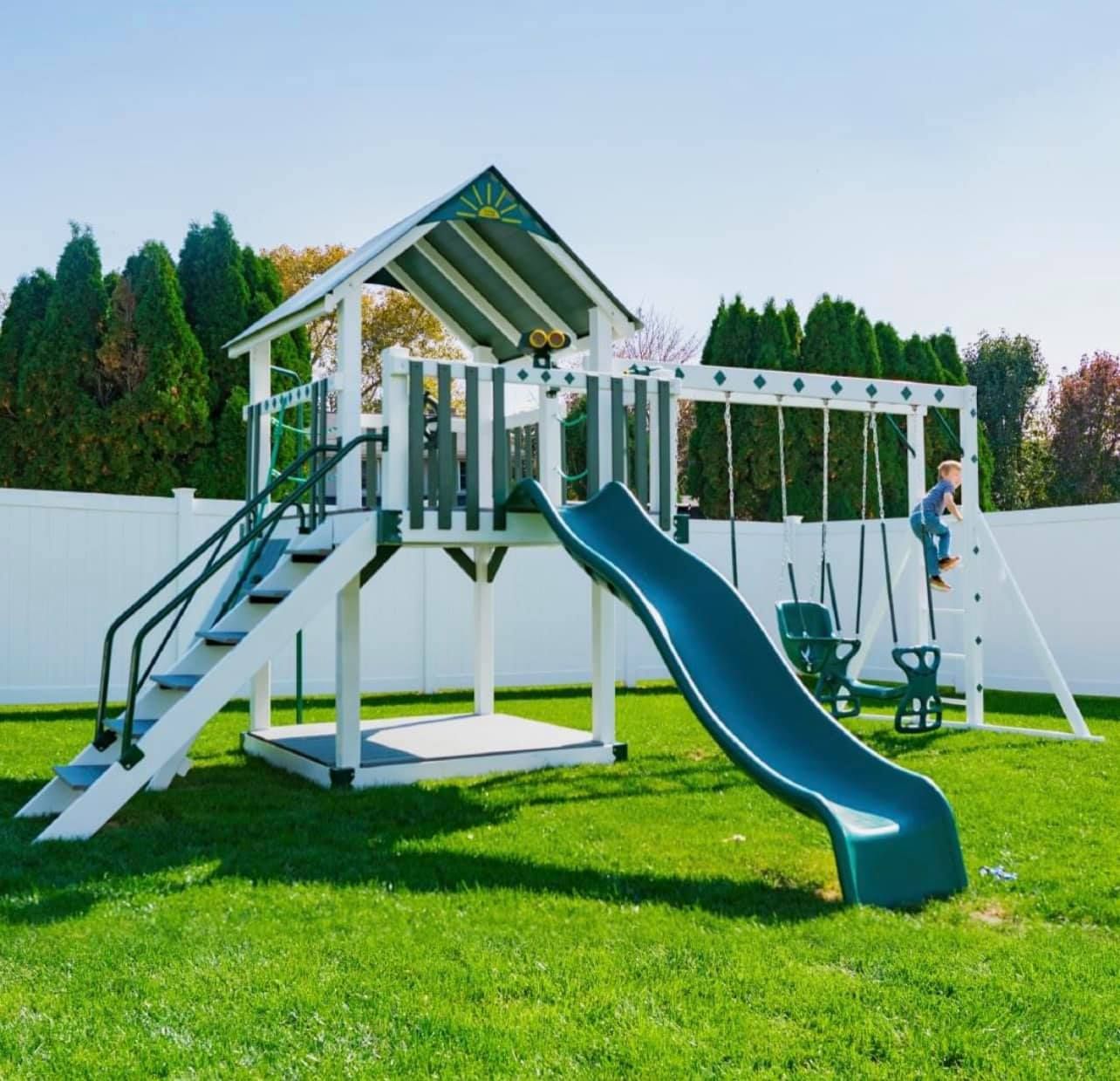 A playground with a slide swings and stairs