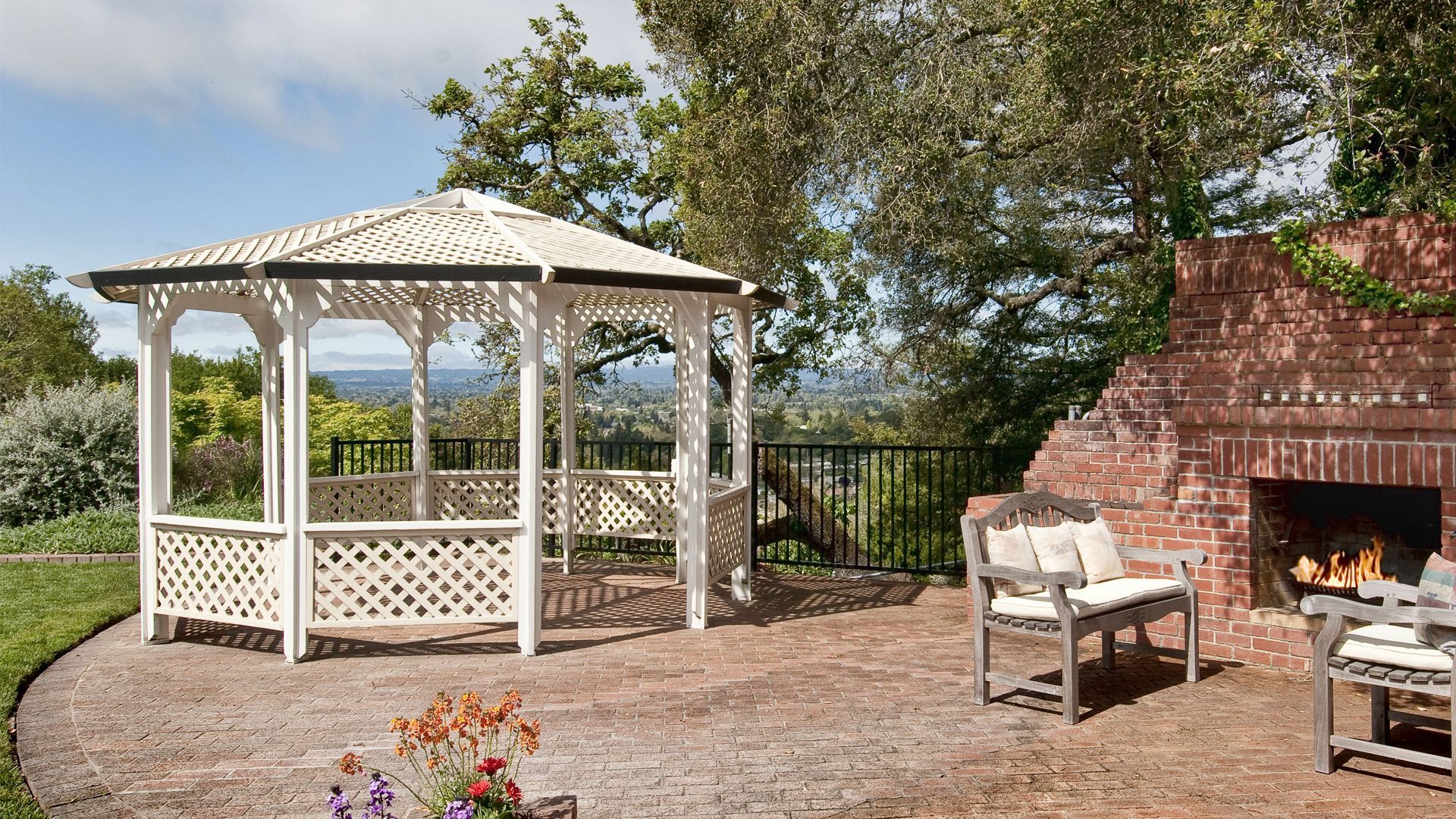 There is a gazebo and a fireplace in the backyard.