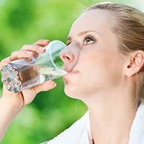 Young woman drinking water