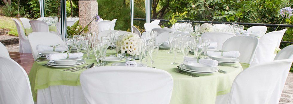 Green and white tables and chairs set-up.