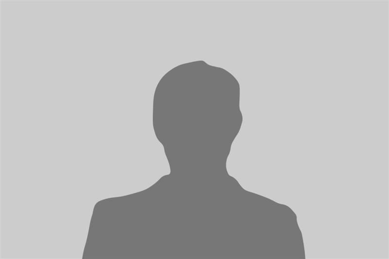Silhouette of a person with a suit on a gray background.