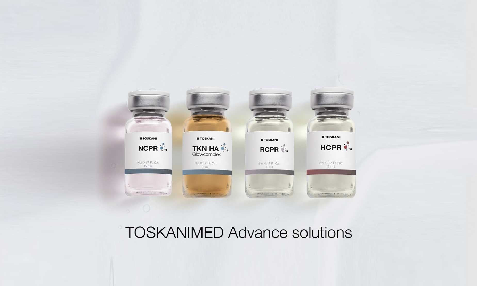 Four vials of TOSKANIMED Advance solutions in a row.