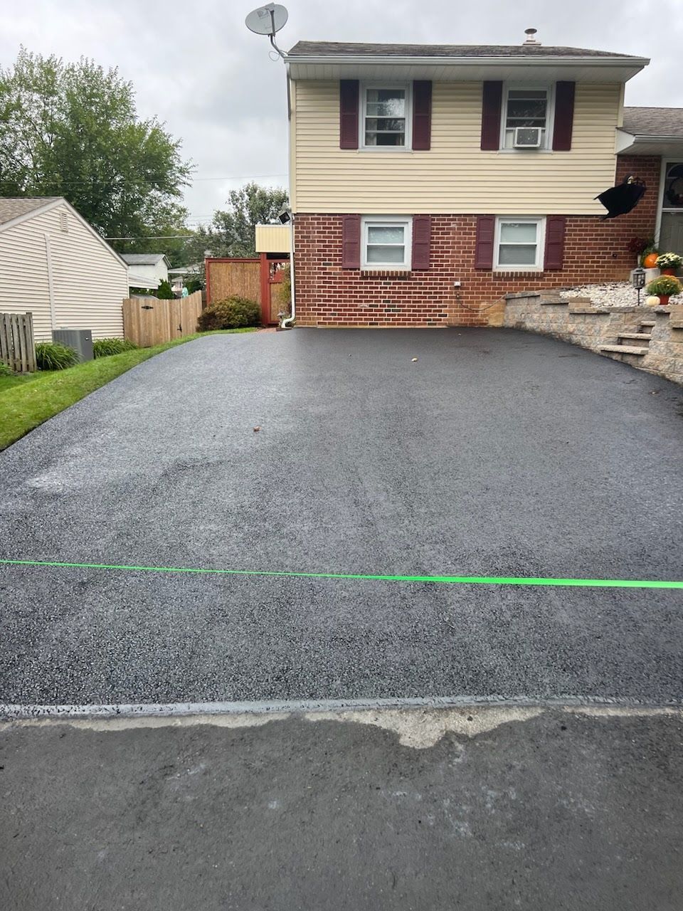 a brick house with a satellite dish on top of it