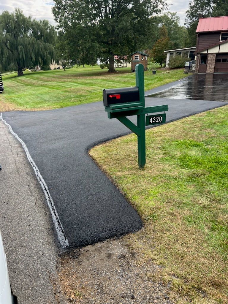 there is a mailbox on the side of the road .