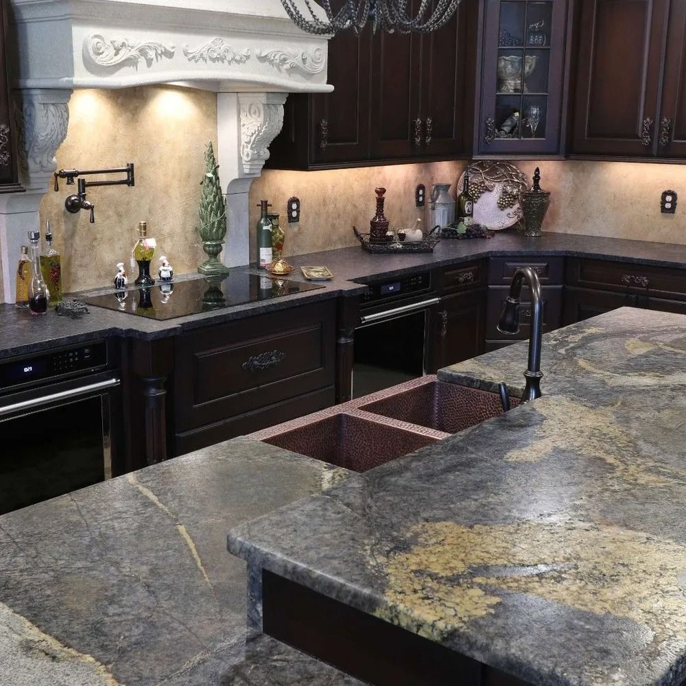 Kitchen with dark cabinets, granite countertops, and a copper sink.