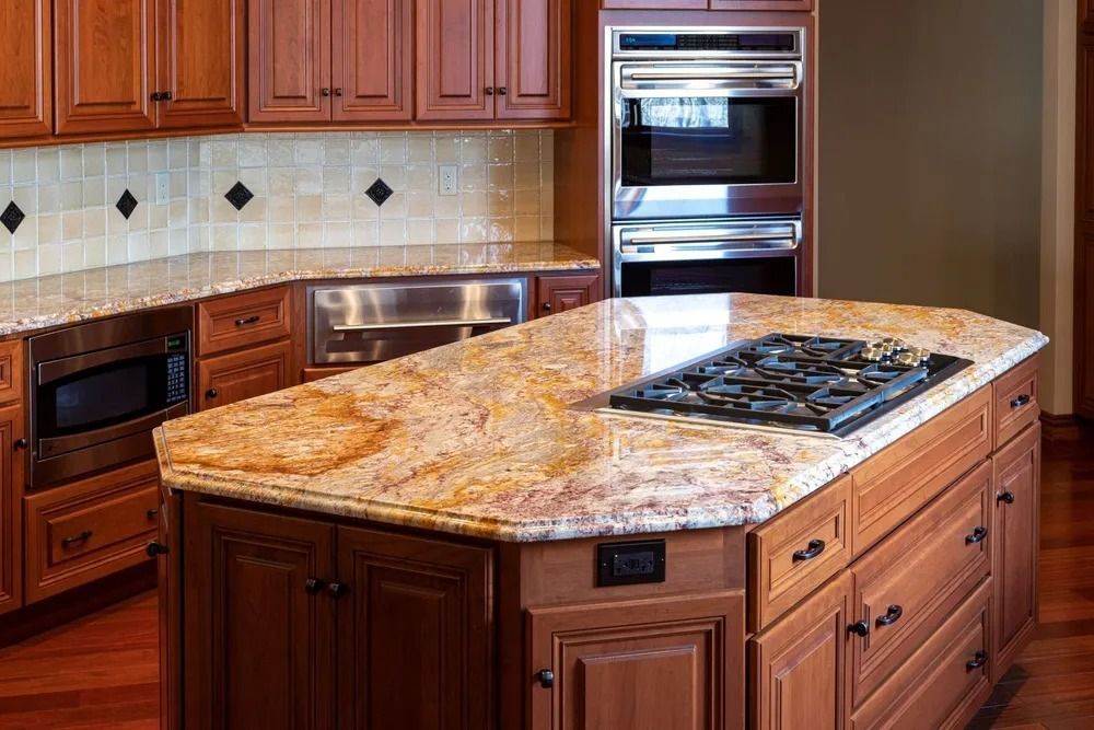 Kitchen with granite countertops and dark wood cabinets. Includes a stove, microwave, and double oven.