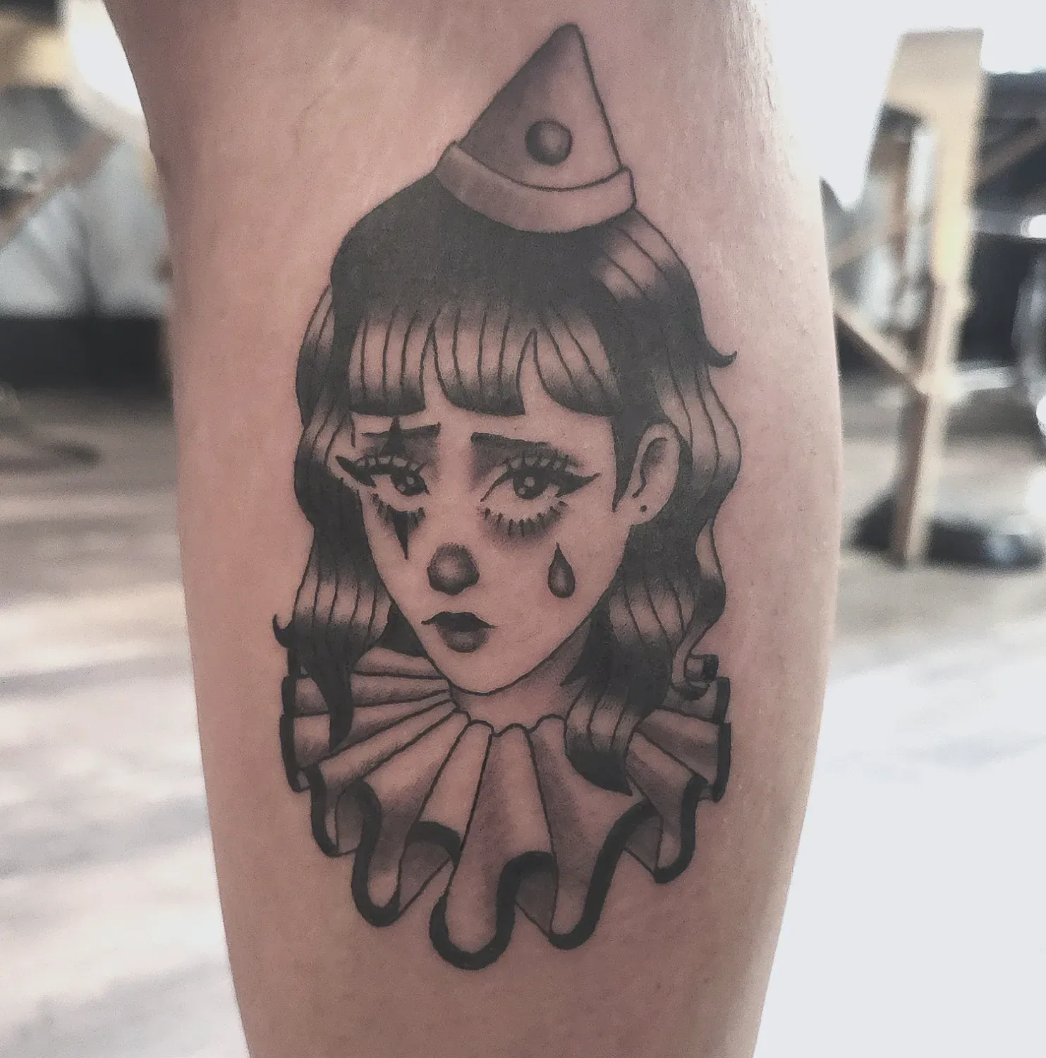 Crying clown tattoo