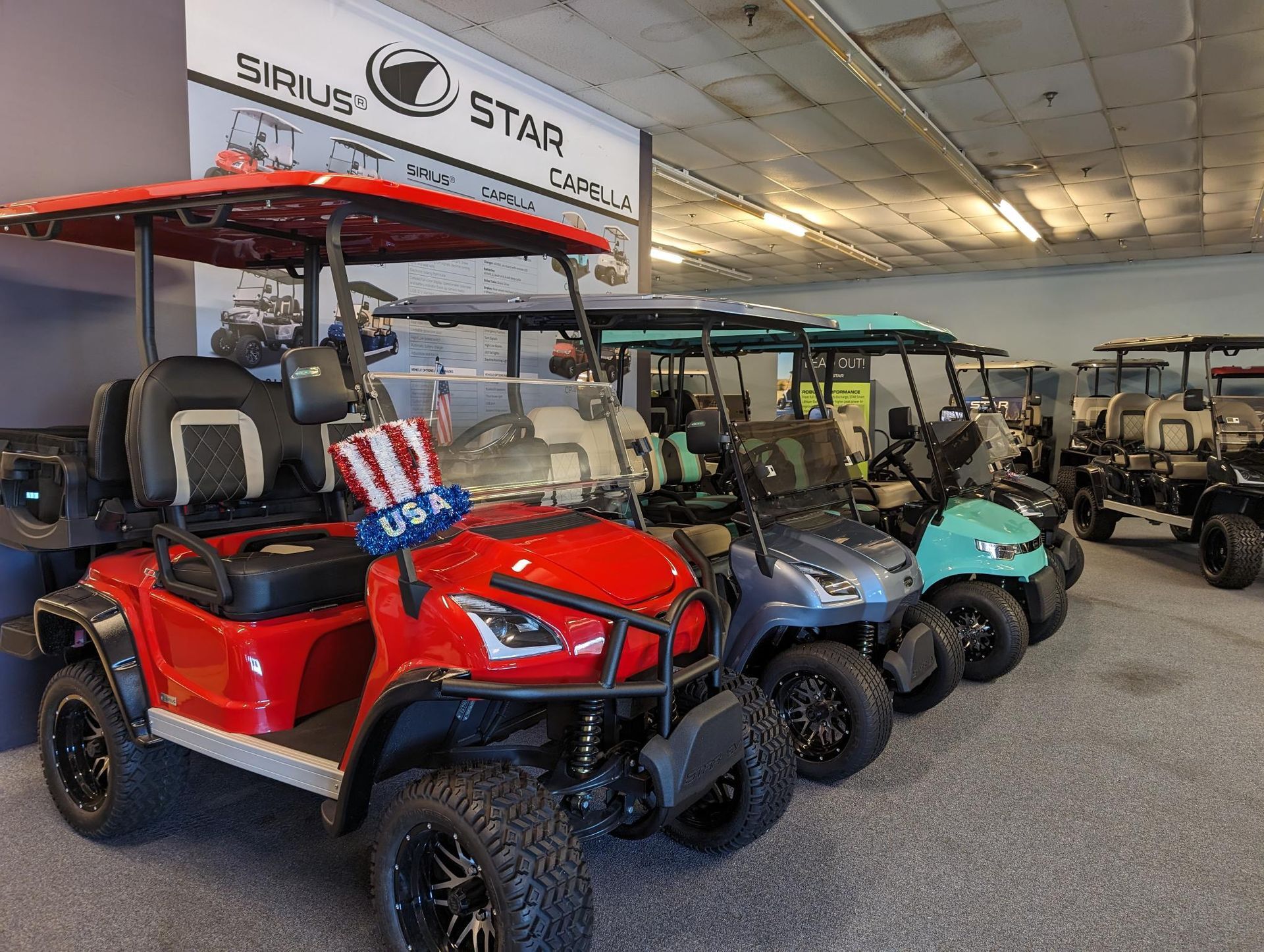 a row of golf carts are lined up in a showroom