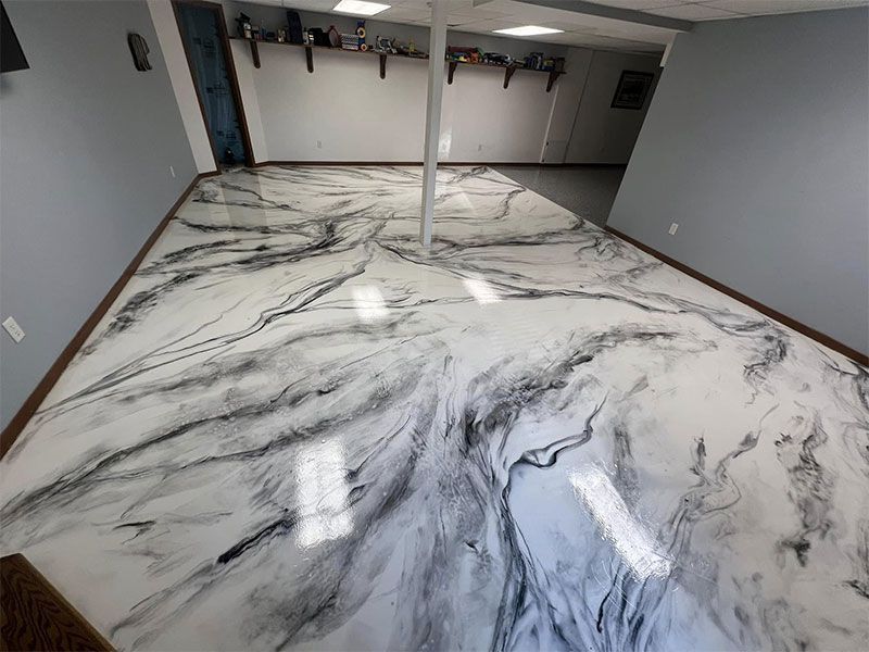 Empty gray room with glossy white-and-black marble floor and ceiling-mounted lights