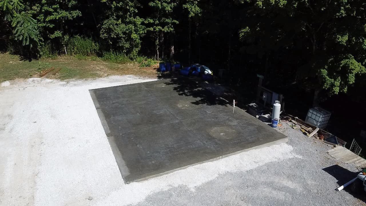 An aerial view of a concrete pad in a parking lot.