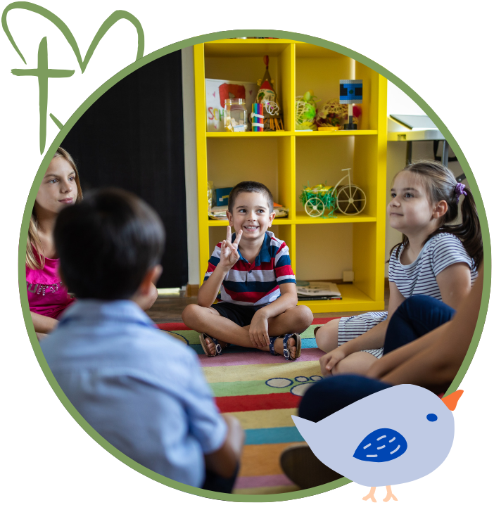 Children sitting in a circle, one smiling and giving a peace sign, in a room with a yellow shelf.