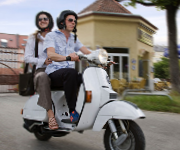 Couple riding a scooter