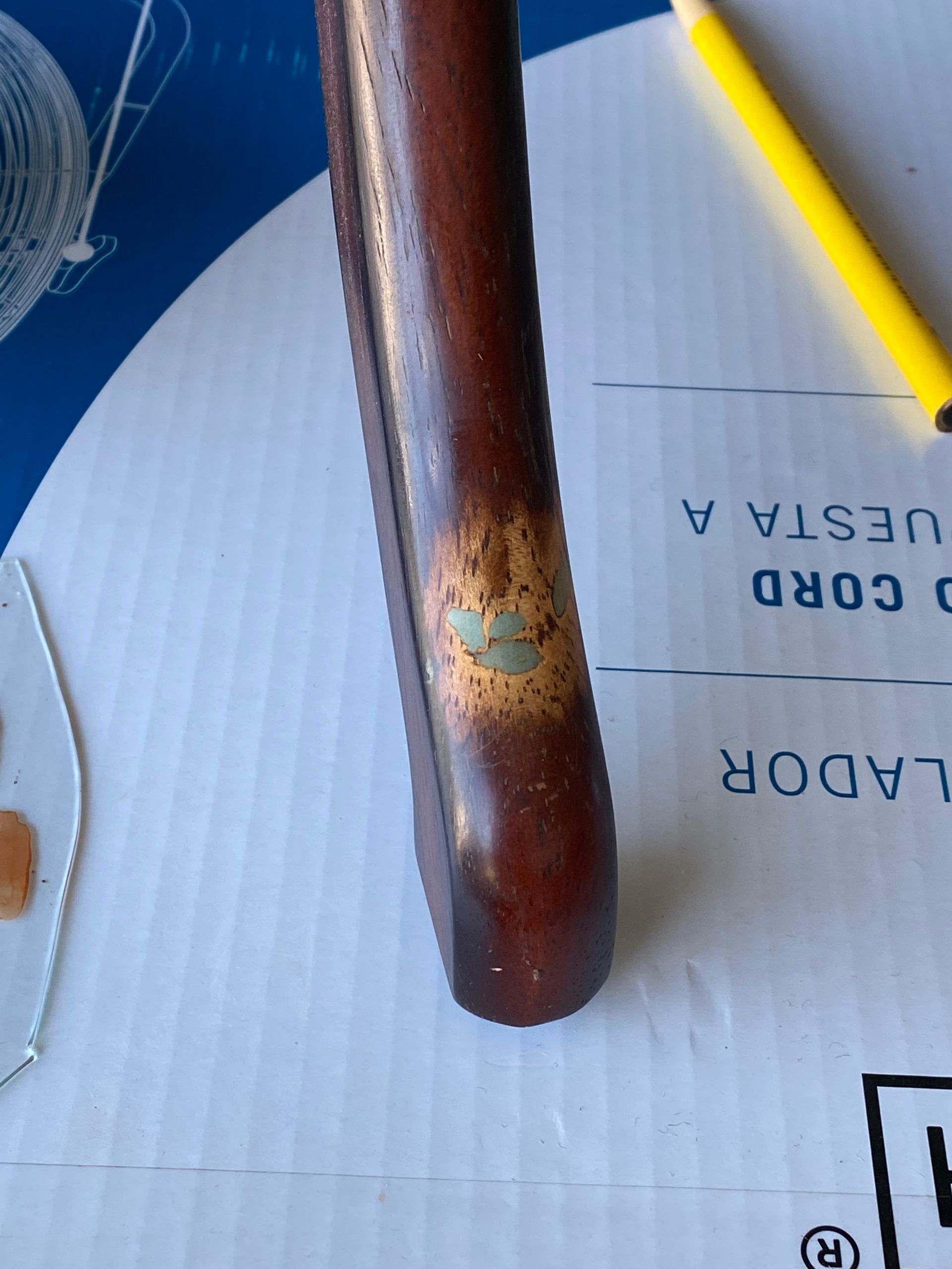 A yellow pencil is on a piece of paper that says nuestra a cord