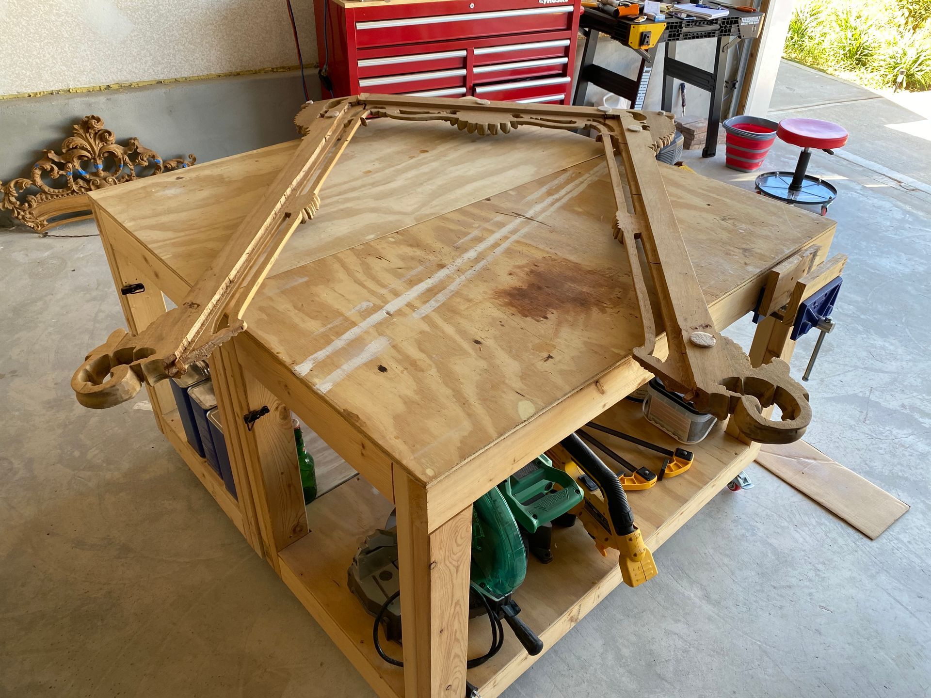 A wooden workbench with tools on it in a garage