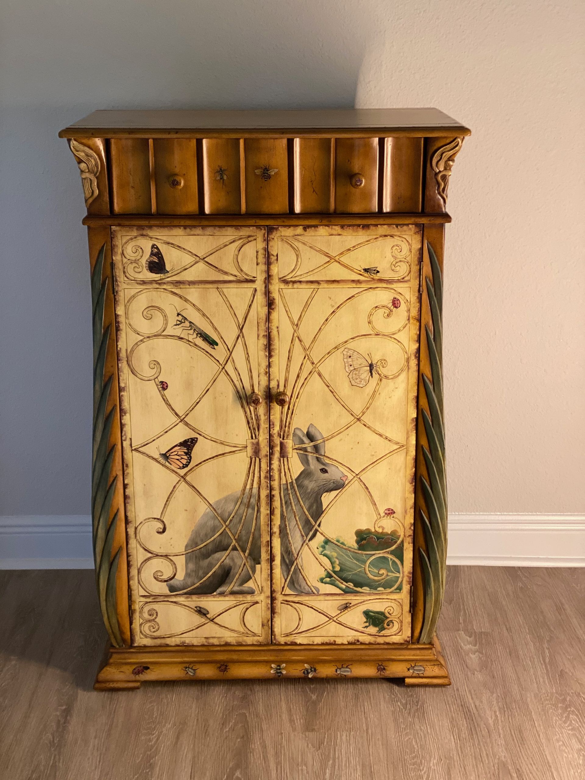 A cabinet with a picture of a rabbit on it