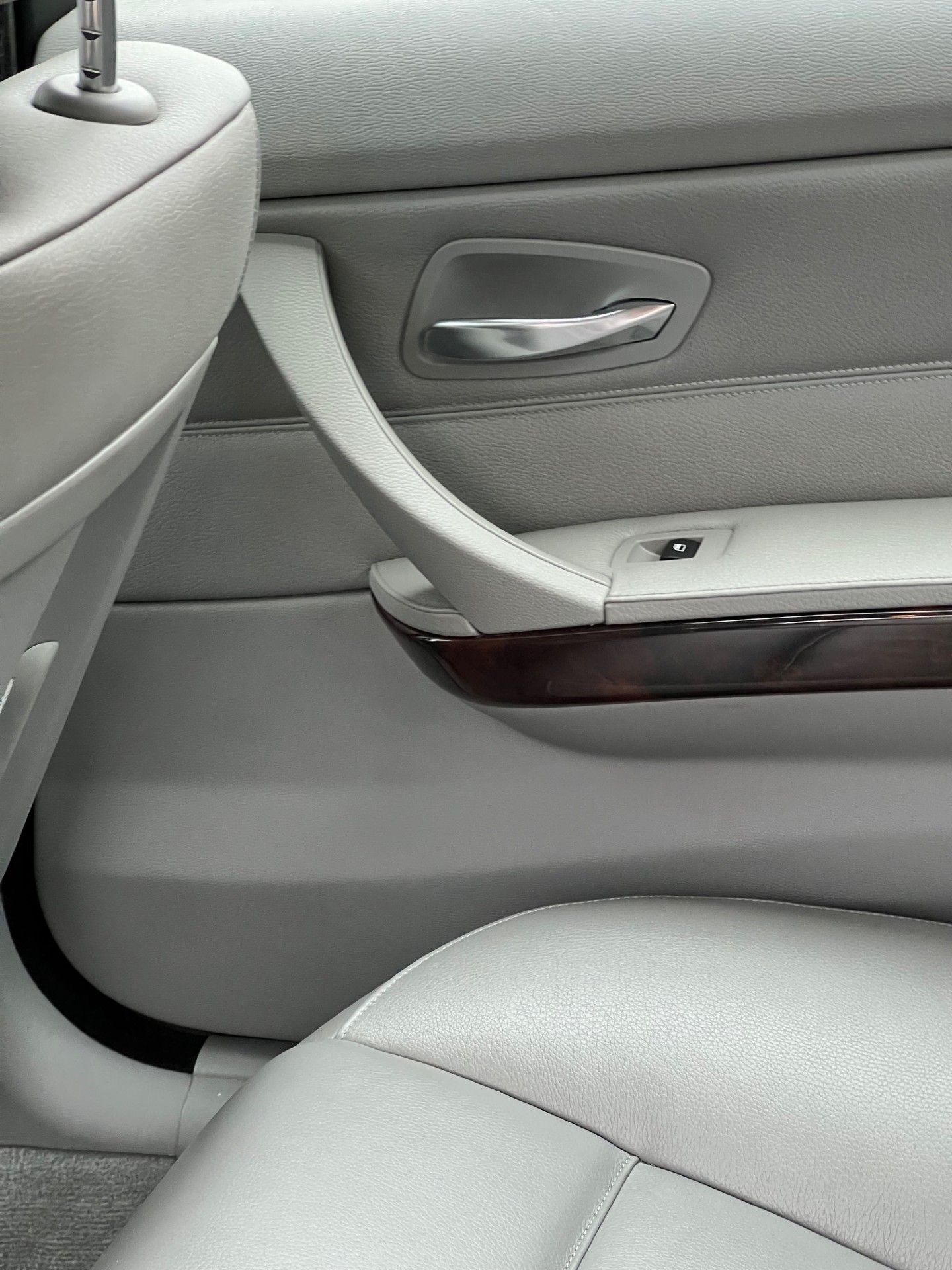 A close up of the door handle of a car.