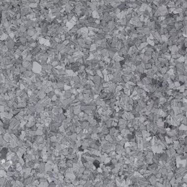 Grey, textured surface with flecks, likely a flooring material.