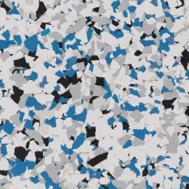 Floor with blue, black, gray, and white speckled epoxy.