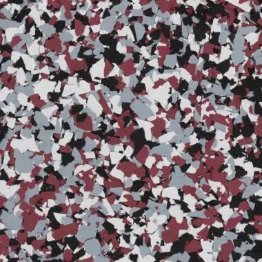 Multi-colored floor coating with maroon, black, grey, and white chips.