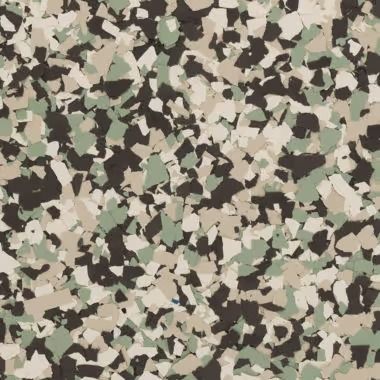 Close-up of a speckled floor. The chips are a mix of light green, beige, and dark brown.