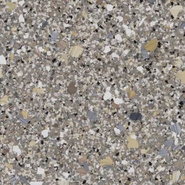Gray, speckled surface with white, tan, and black chips.