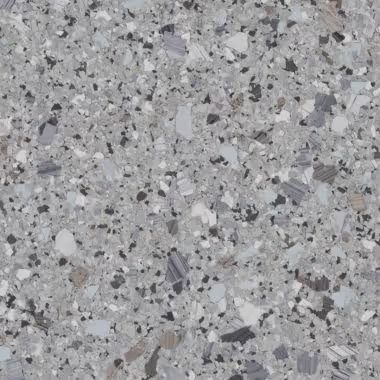 Gray terrazzo pattern with flecks of various colors and sizes.