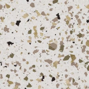 White terrazzo surface with flecks of black, brown, and olive green.