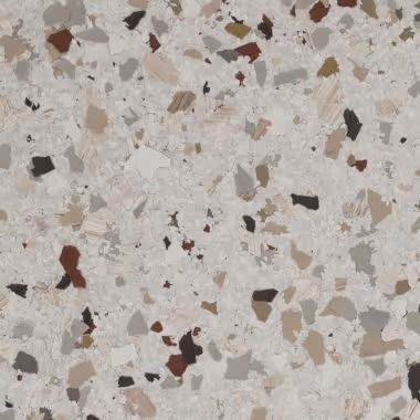 Terrazzo tile with a white base and flecks of brown, gray, and tan.