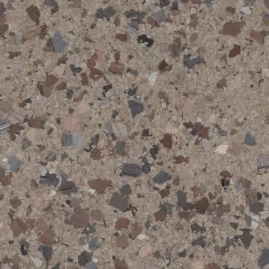 Close-up of a speckled, brown and gray stone surface.