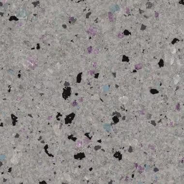 Gray speckled surface with black, purple, and blue flecks.