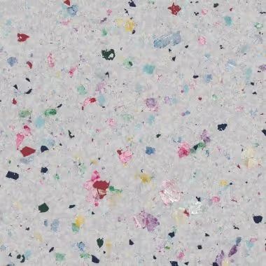Gray speckled surface with colorful flecks.