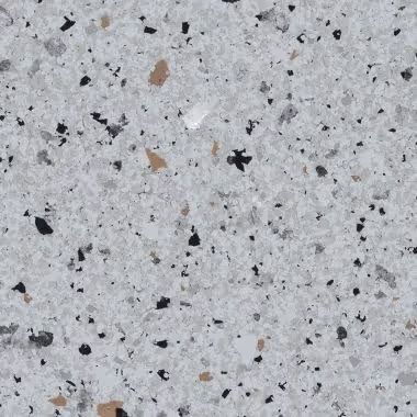 Light gray speckled surface with black, beige, and white flecks.