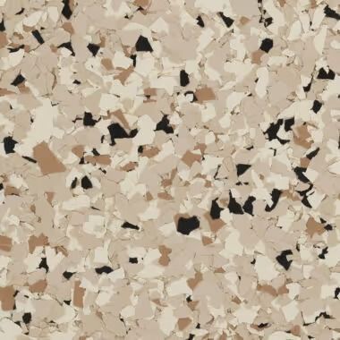 Close-up of a speckled floor coating, featuring tan, brown, black, and cream colored flakes.