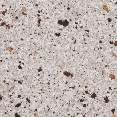 Gray speckled countertop with brown and tan flecks.