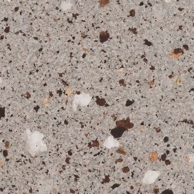 Gray speckled stone surface with brown and white aggregate.