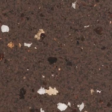 Brown speckled surface with white, tan, and dark flecks.