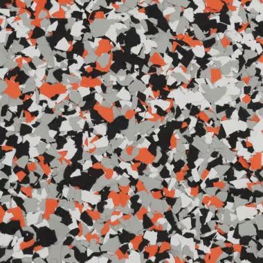 Multi-colored floor coating with orange, black, white, and gray flakes.
