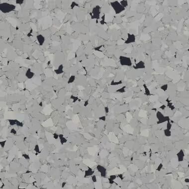 Gray and white speckled flooring with dark gray and black flecks.