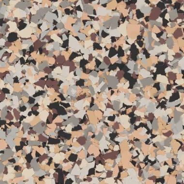 Multi-colored epoxy floor coating with tan, black, and gray chips.