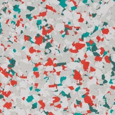 Speckled flooring with red, teal, and gray chips on a light gray background.