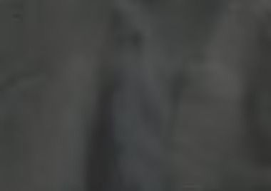 Abstract, dark gray and black textured background.