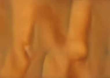 Blurred orange figure with a knee and leg.