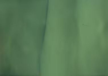 Green fabric, with vertical folds and a dark spot.