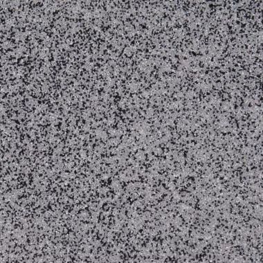 Gray speckled surface with dark spots.