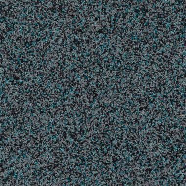 Close-up of a speckled, dark gray and teal surface resembling granite or rough stone.